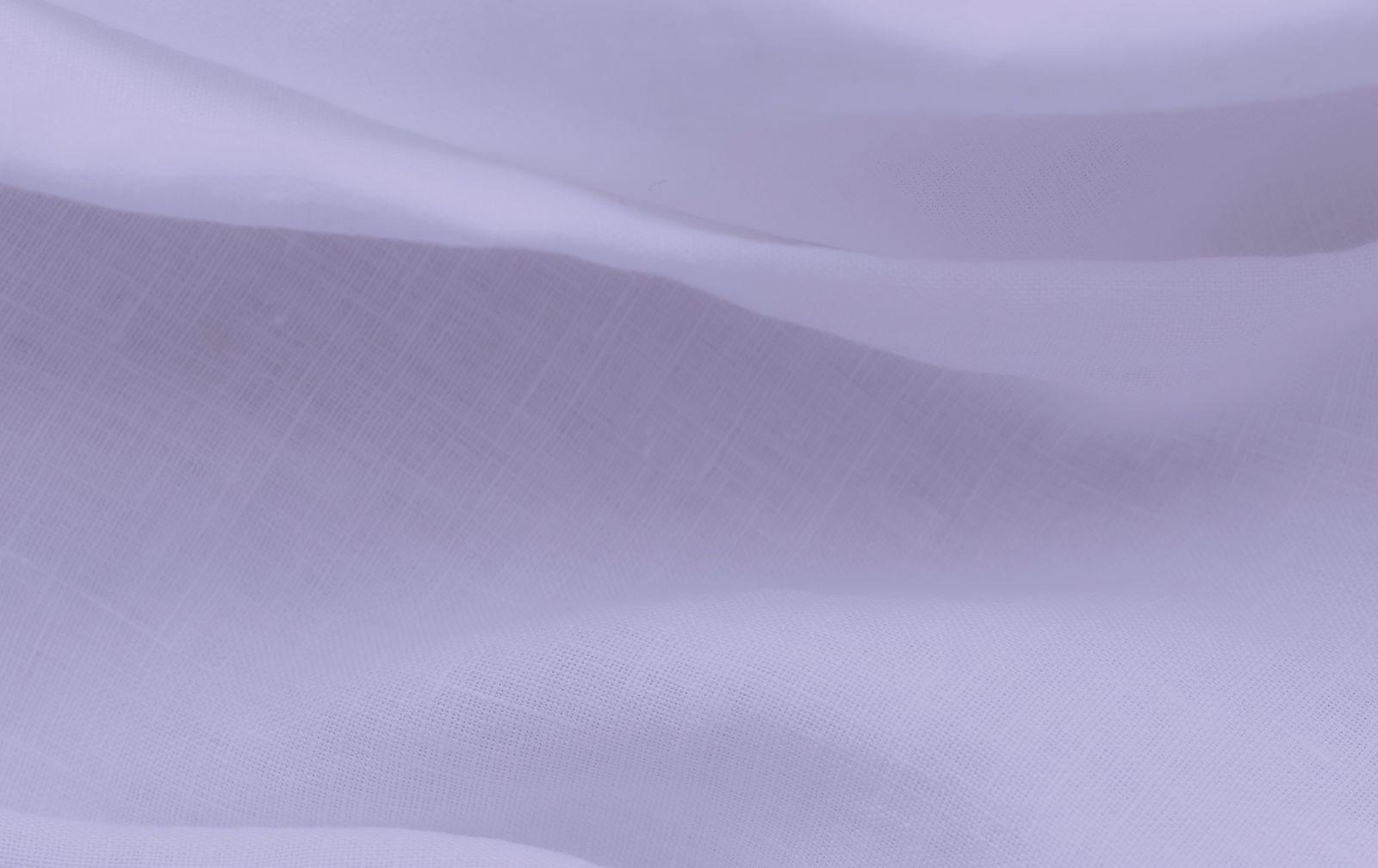 Soft, flowing lavender fabric draped elegantly.